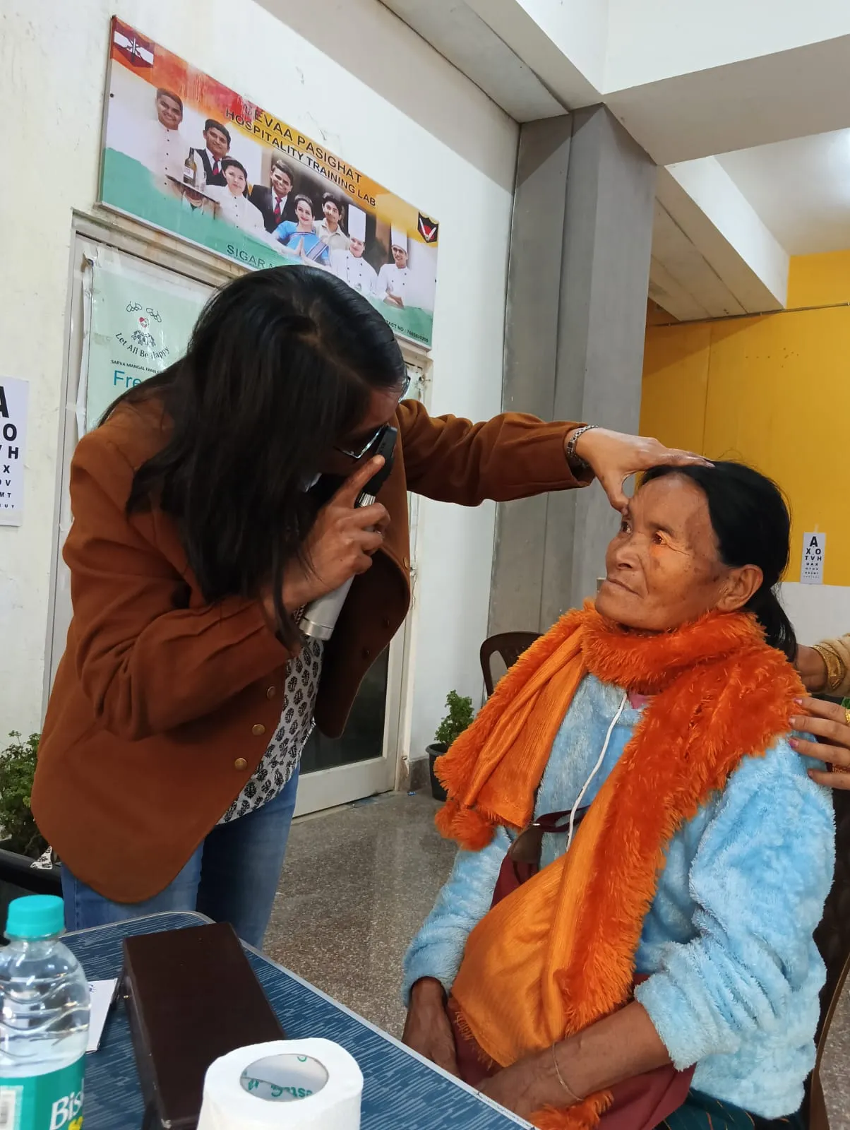 Apatani Youth Association (AYA) volunteers assisting elderly patients.